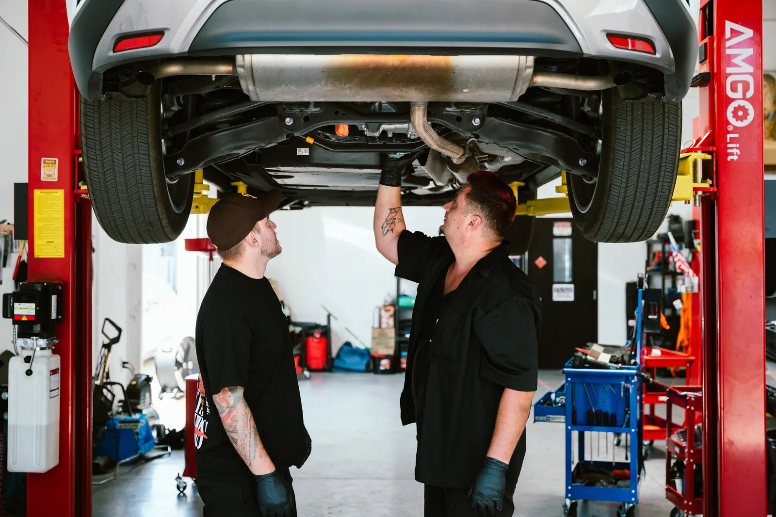 Cali Car Care mechanics consulting on a vehicle repair in Escondido, CA